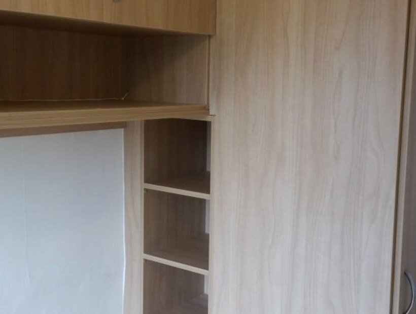 Fitted bedroom furniture with a built-in desk and storage in a Warrington study bedroom