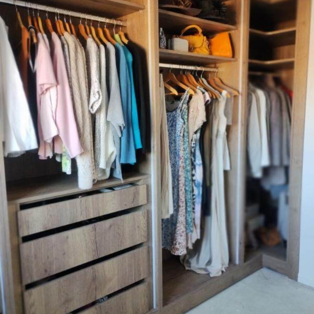 Custom fitted wardrobe interior with shelving and drawers