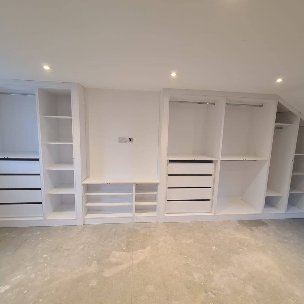 Large run of fitted wardrobes in a Warrington bedroom