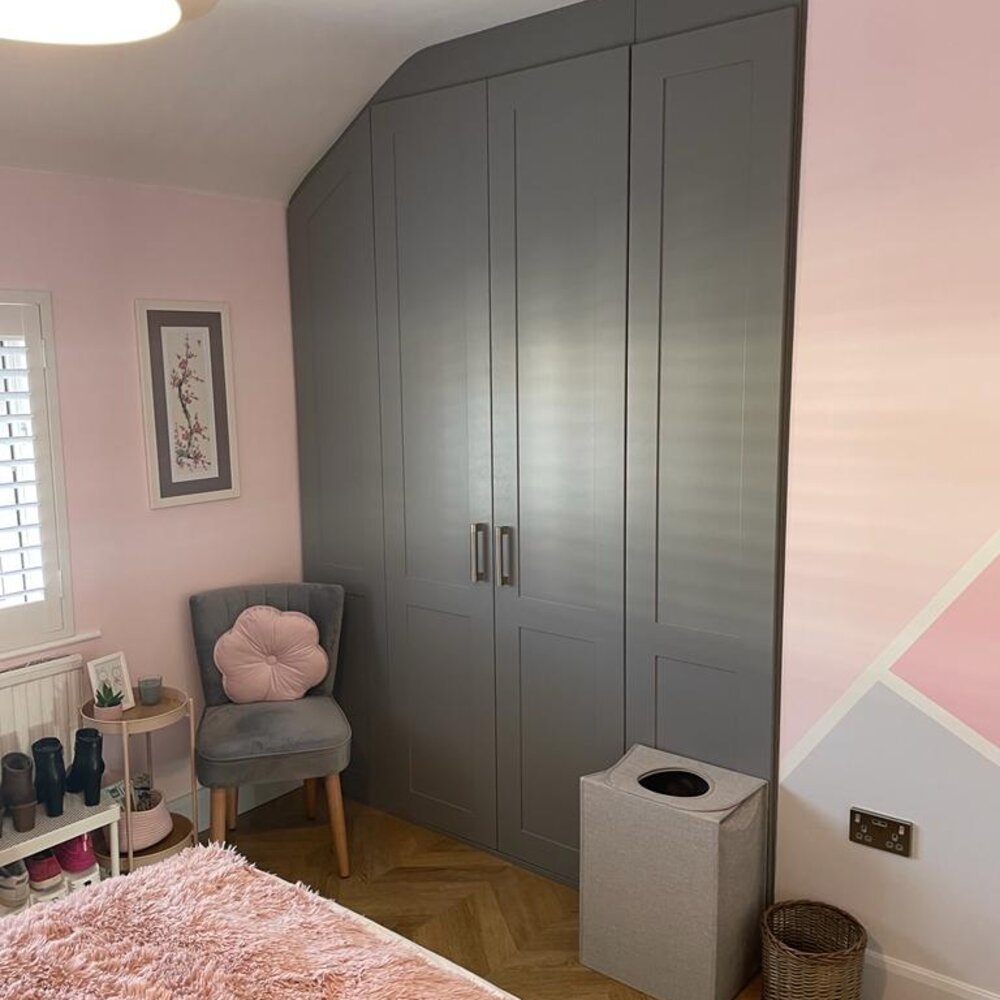 White fitted wardrobe with a built-in dressing table
