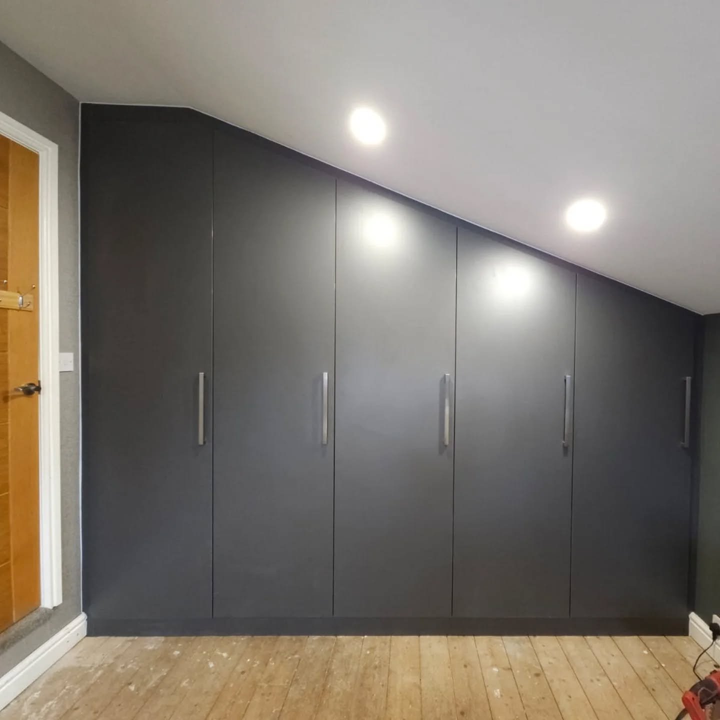 Custom wardrobes made to measure and fitted to ceiling slope / low eaves.