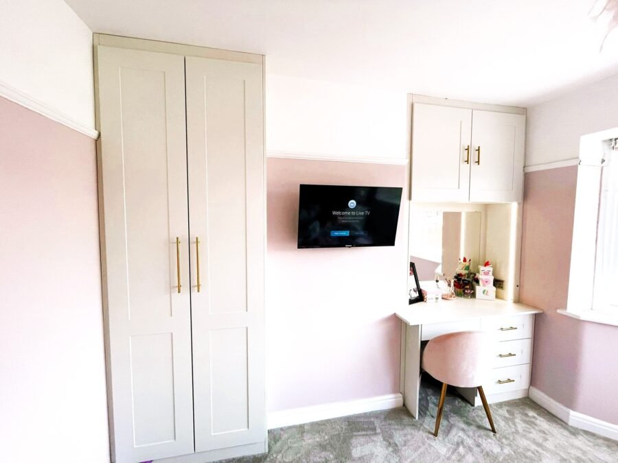 Fitted alcove wardrobes and dressing table built around a chimney breast in a Warrington bedroom