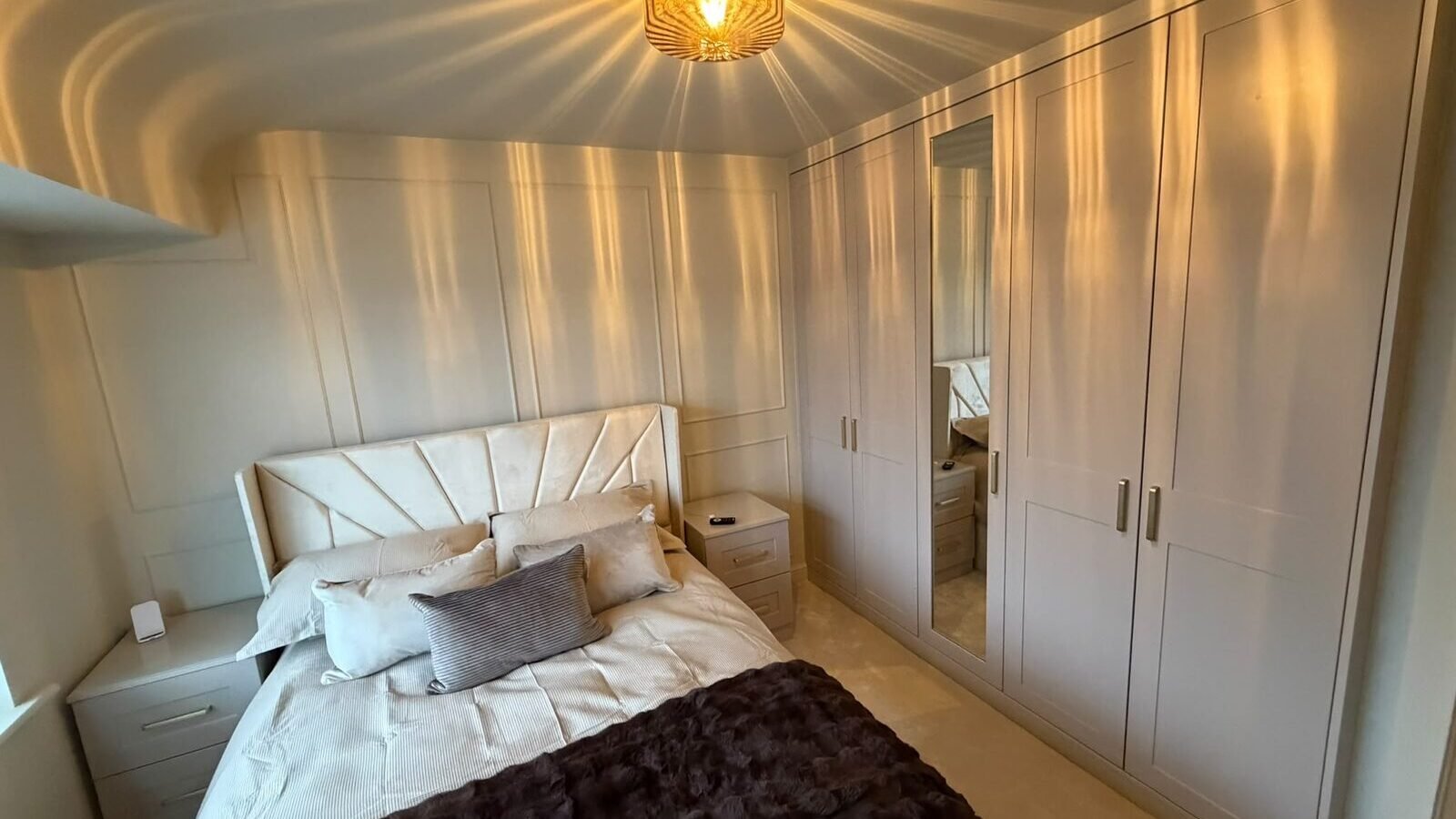 Built in wardrobe ideas with shaker doors and matching bedside drawers in a bedroom