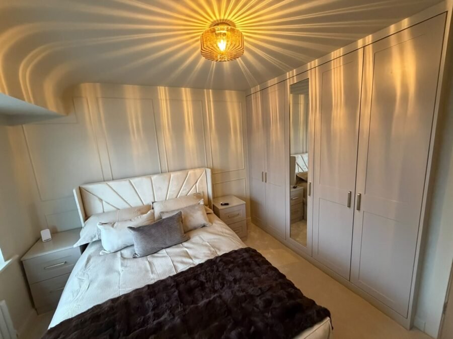 Built in wardrobe ideas with shaker doors and matching bedside drawers in a bedroom